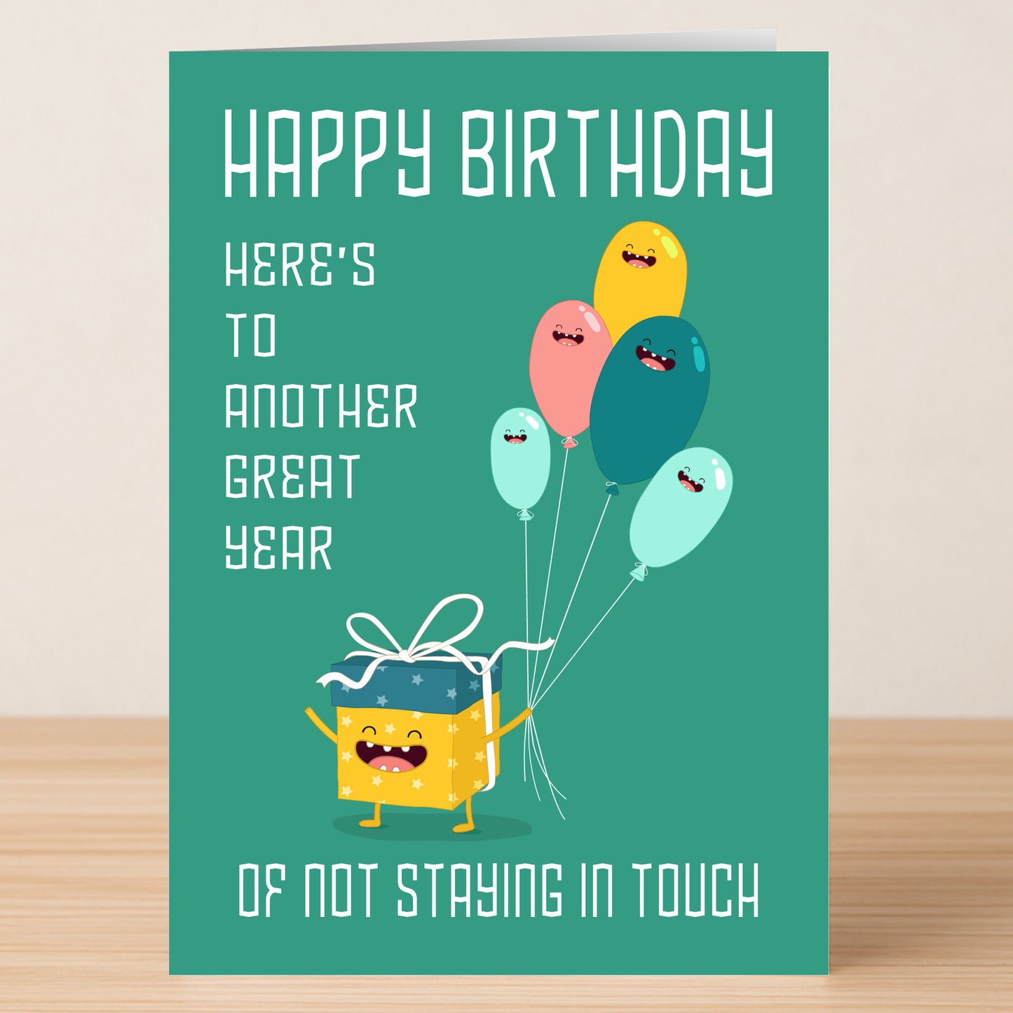 The Great Yea – Funny Birthday Card by Twisted Gifts features cartoon balloons, a gift character, and the message: "Happy Birthday. Here’s to another great year of not staying in touch.