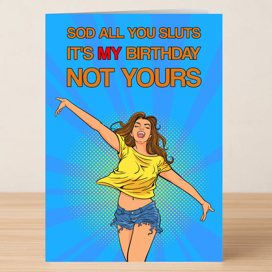 The Sod All – Funny Birthday Card by Twisted Gifts features a cartoon woman in a yellow top and blue shorts with bold text: "SOD ALL YOU SLUTS IT'S MY BIRTHDAY NOT YOURS" on a bright blue background.