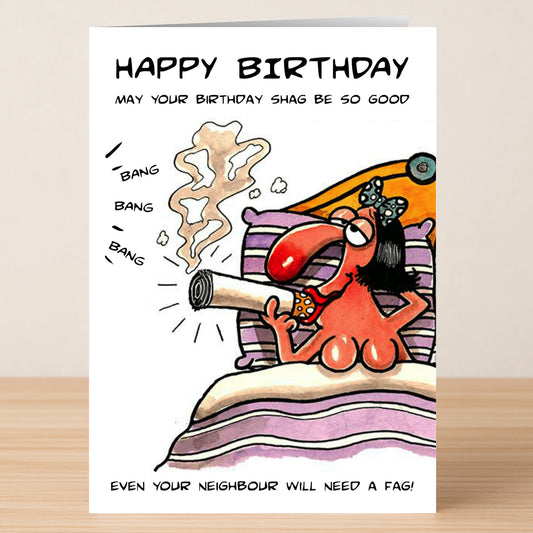 The Neighbour – Rude Birthday Card by Twisted Gifts features a cartoon person in bed with a giant cigarette and the phrase "HAPPY BIRTHDAY... Even your neighbour will need a fag!" Perfect for anyone who enjoys cheeky humor on their birthday.