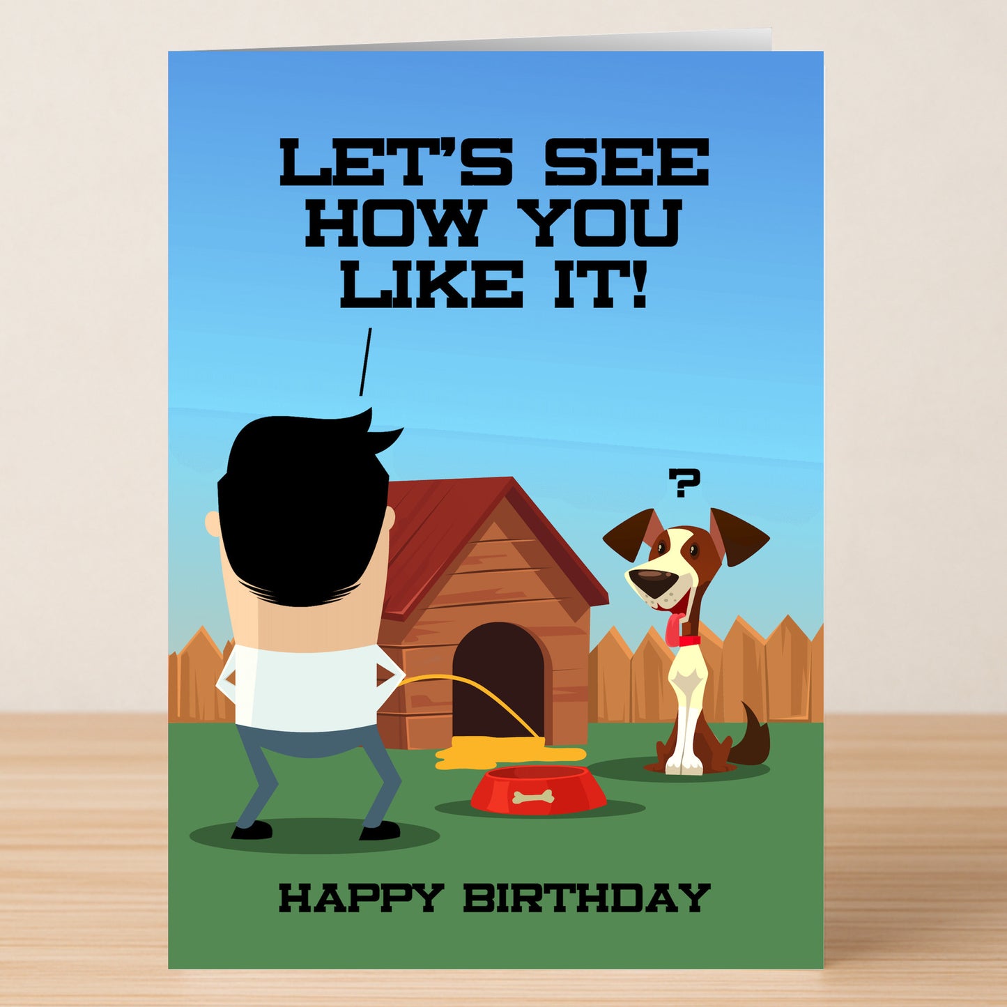 The Twisted Gifts Doghouse Funny Birthday Card features a man at a dog's house as the puzzled pet watches, with “LET'S SEE HOW YOU LIKE IT!” above, creating a memorable and humorous birthday greeting.