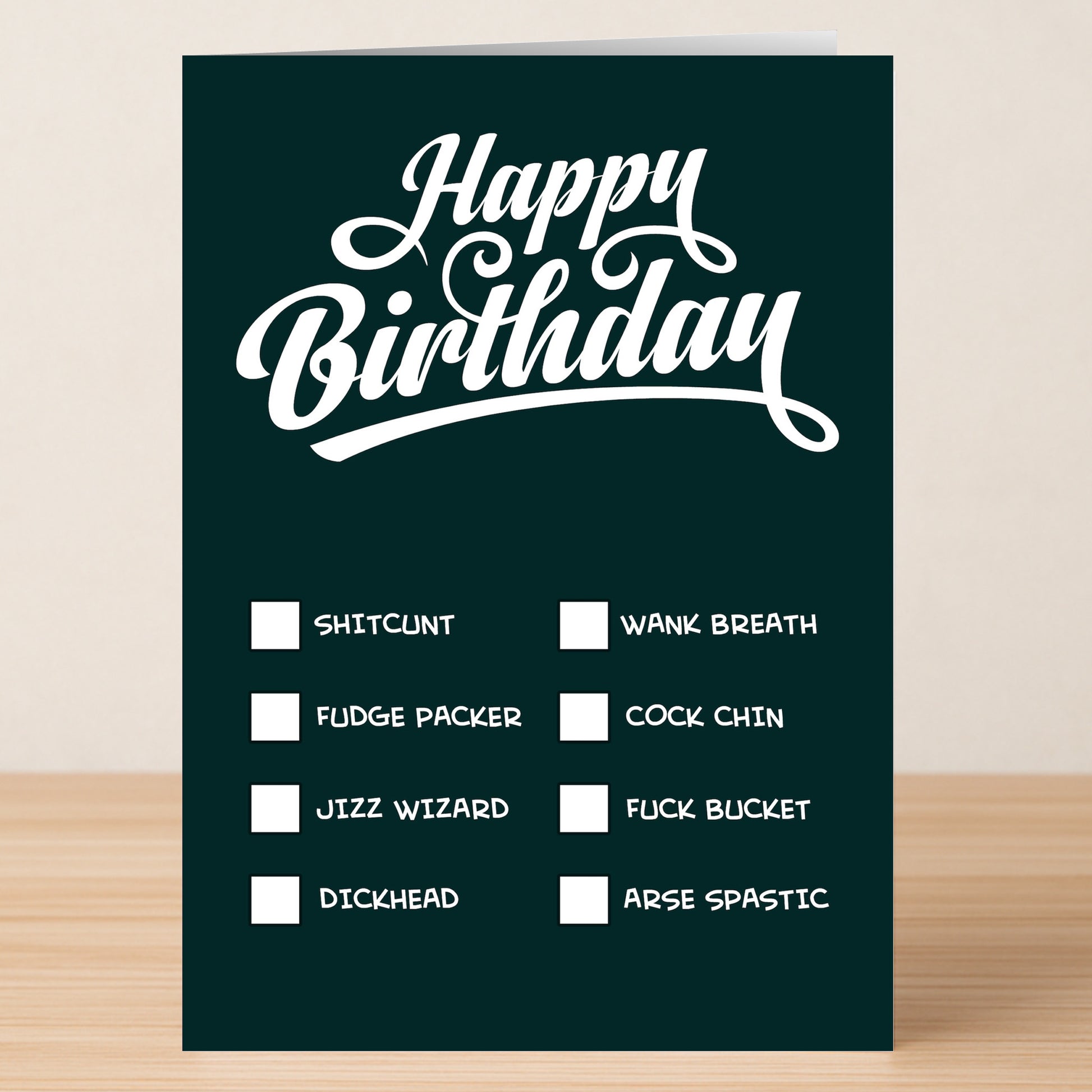The Twisted Gifts "Check List – Insulting Birthday Card" features bold white "Happy Birthday" text and a list of funny insult checkboxes on a dark background.