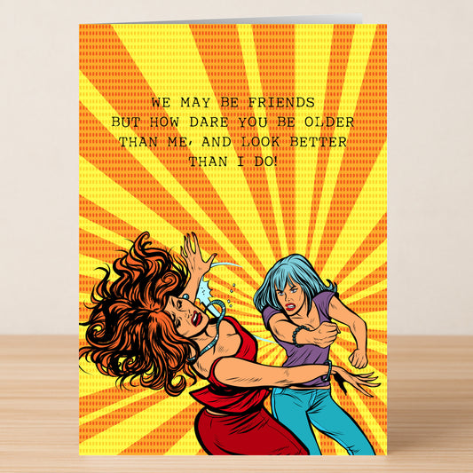 The "How Dare You – Funny Birthday Card" by Twisted Gifts features two comic-style women facing off with the text: "We may be friends but how dare you be older than me, and look better!" Perfect for your fiercest friend’s birthday.