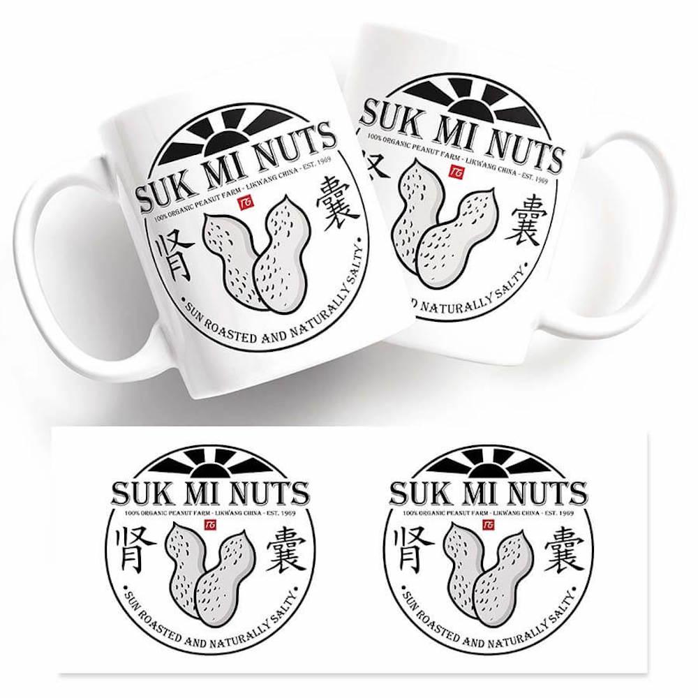 A hilarious gift for any occasion, the Suk Mi Nuts Mug from Twisted Gifts features the twisted phrase "Suk Mi Nuts" printed on it. Perfect for those with a unique sense of humor, these mugs are a must-have.