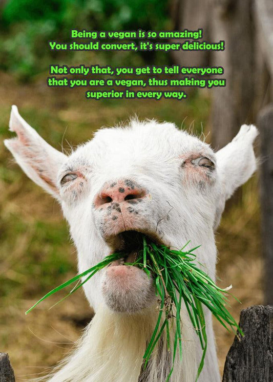 A vegan goat carrying a mouthful of green grass, perfect for a Superior Funny Greeting Card from Twisted Gifts.