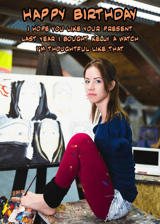 A girl sitting in front of a twisted, dark painting with the words "happy birthday" while holding a Twisted Gifts' Thoughtful Rude Birthday Card.