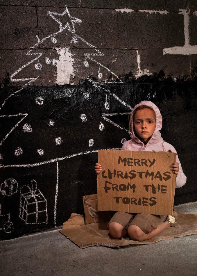 A young girl holding a sign that says Twisted Gifts Funny Christmas Card, poor people.