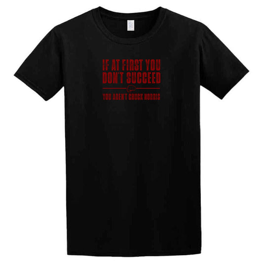 A black Succeed T-Shirt from Twisted Gifts that says if you don't kick the ball, you don't kick the ball.